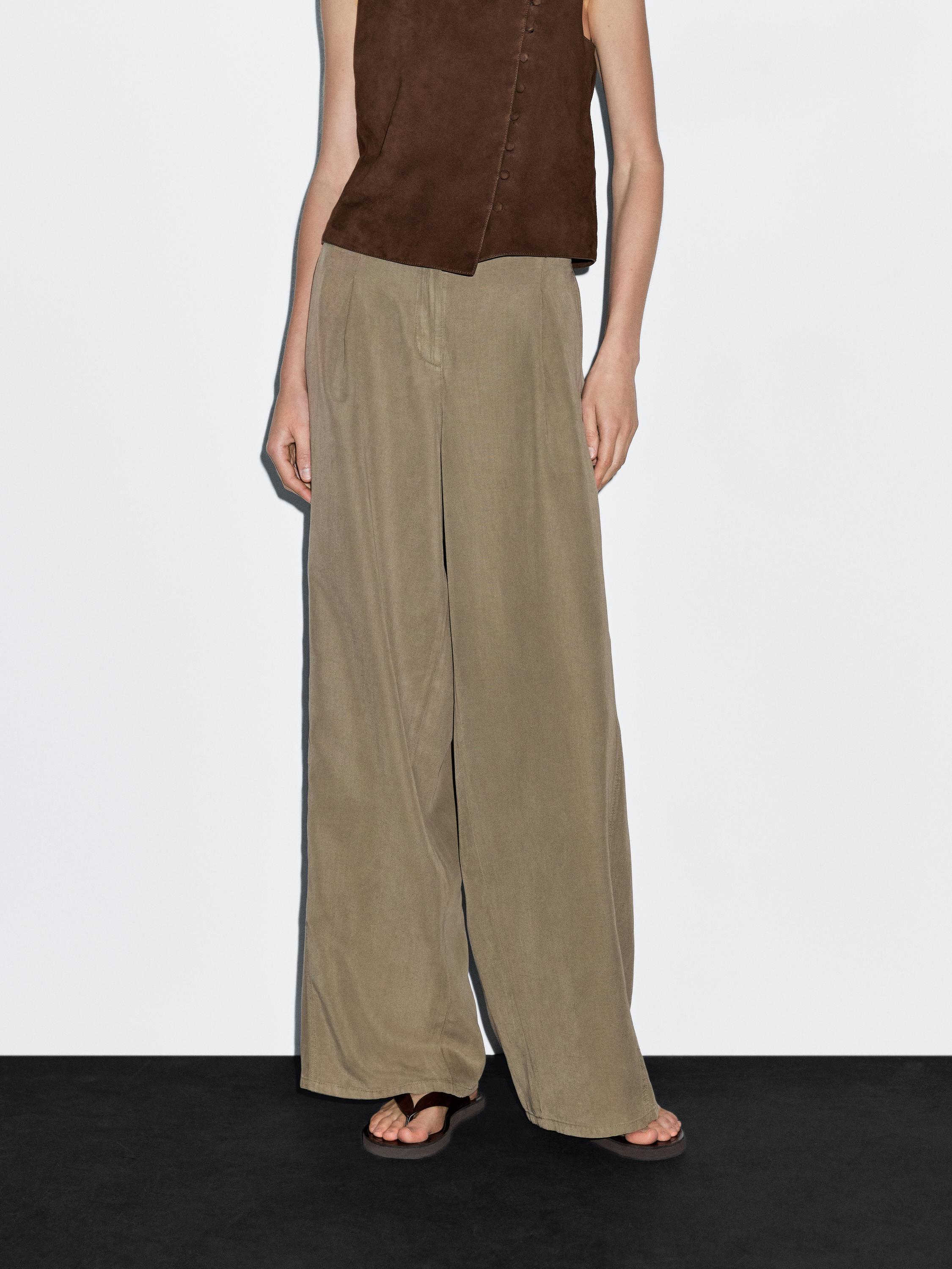 Flowing barrel fit trousers with seam detail